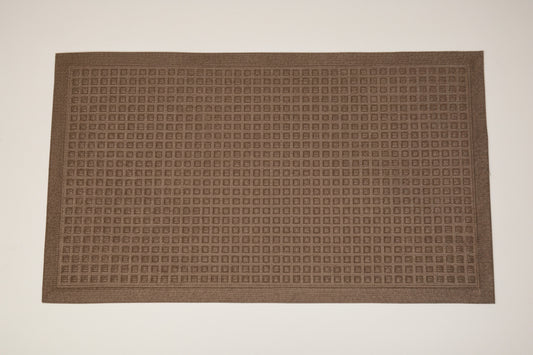 A rectangular brown doormat with a dense grid pattern of small raised square motifs and a decorative border, shown flat against a white background.