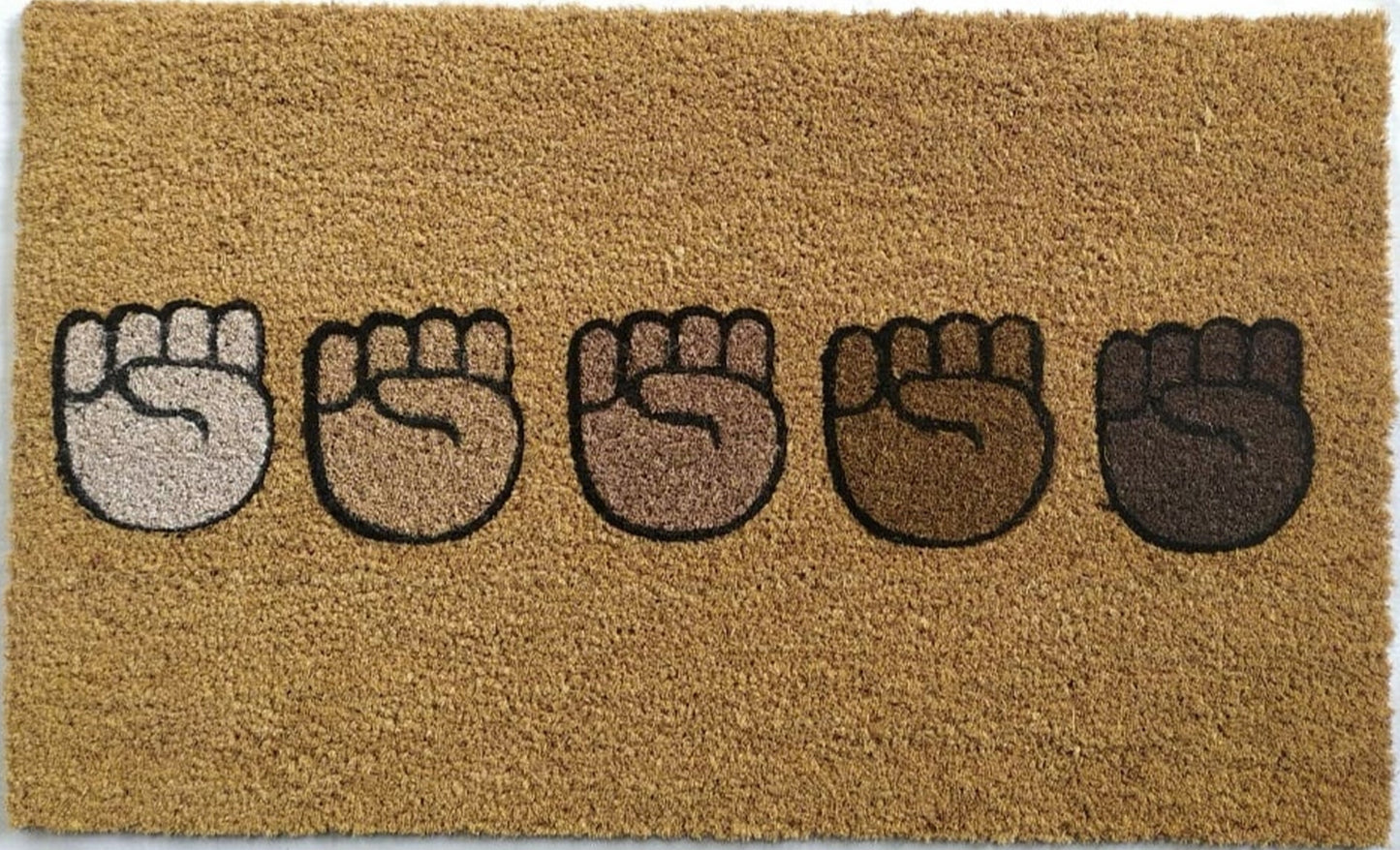 Doormat with five raised fist designs on a beige background