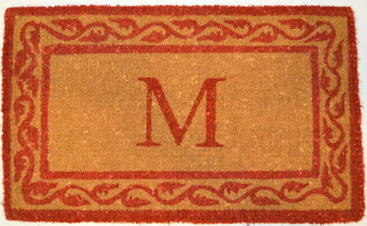 Doormat with a red border and letter 'M' in the center
