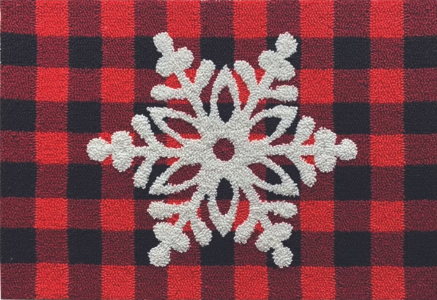 Red and black checkered rug with a white snowflake design