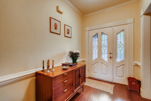 Home entryway showing both an outdoor doormat and an indoor entry rug