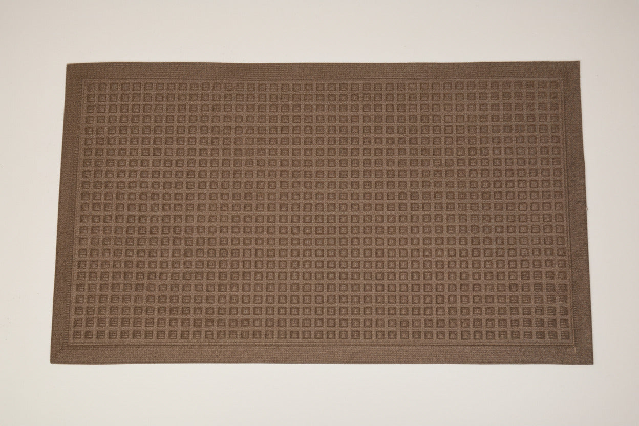 A rectangular brown doormat with a dense grid pattern of small raised square motifs and a decorative border, shown flat against a white background.