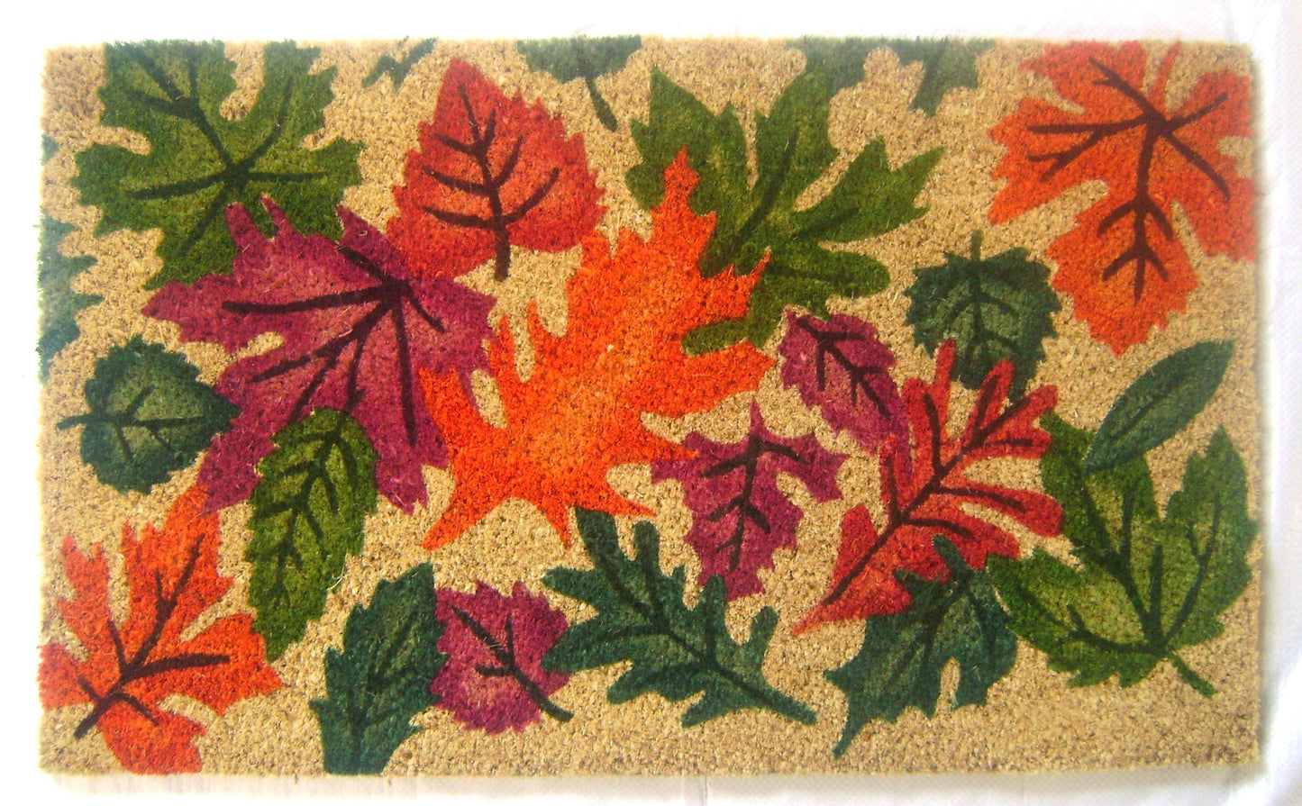 Doormat with colorful autumn leaf design on a beige background