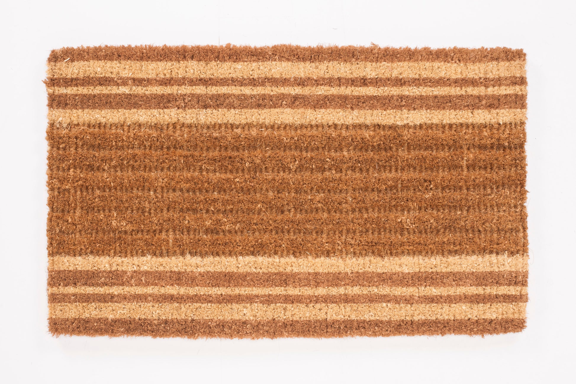 Brown doormat with striped pattern on a white background