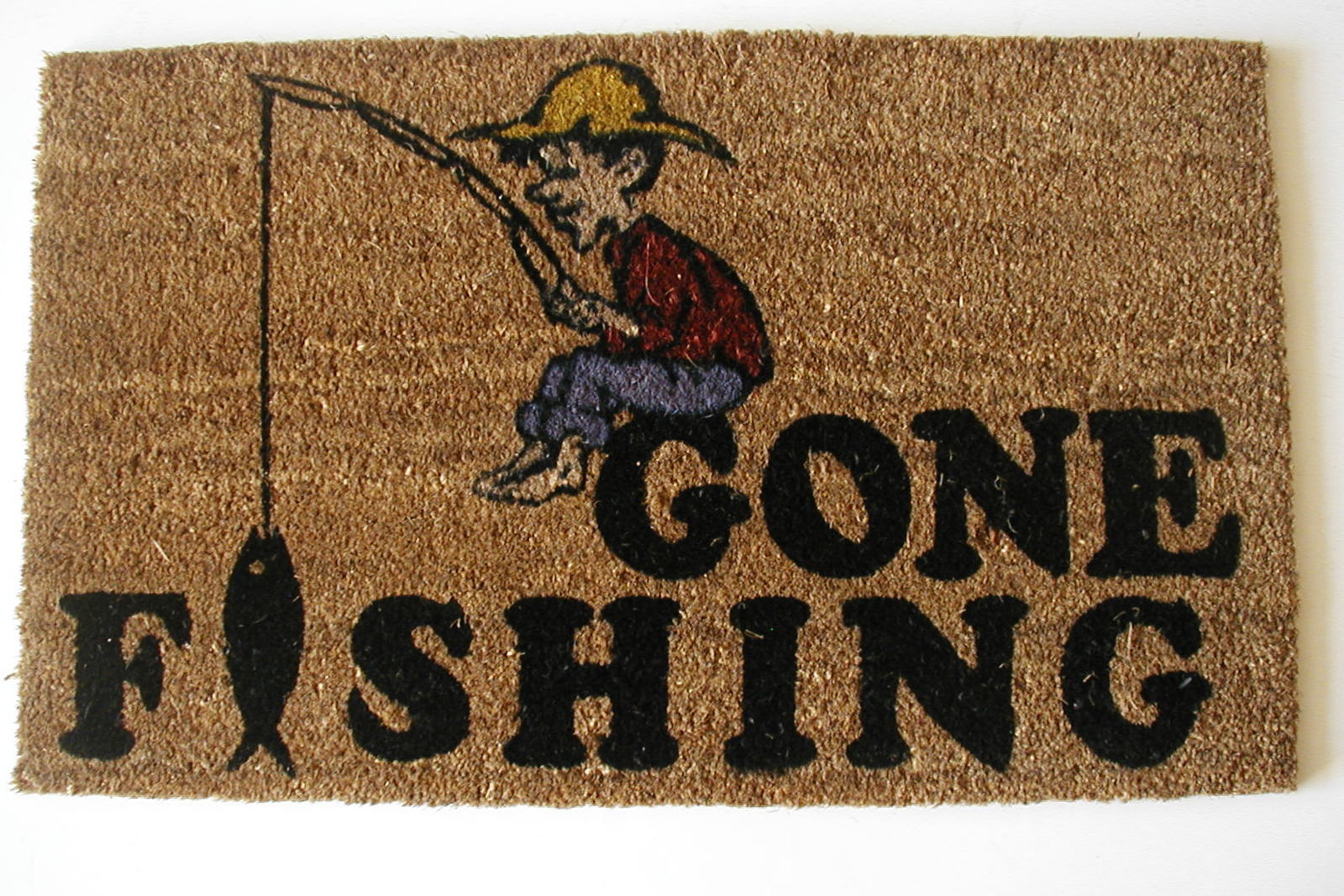 Doormat with a cartoon fisherman and 'Gone Fishing' text on a brown background