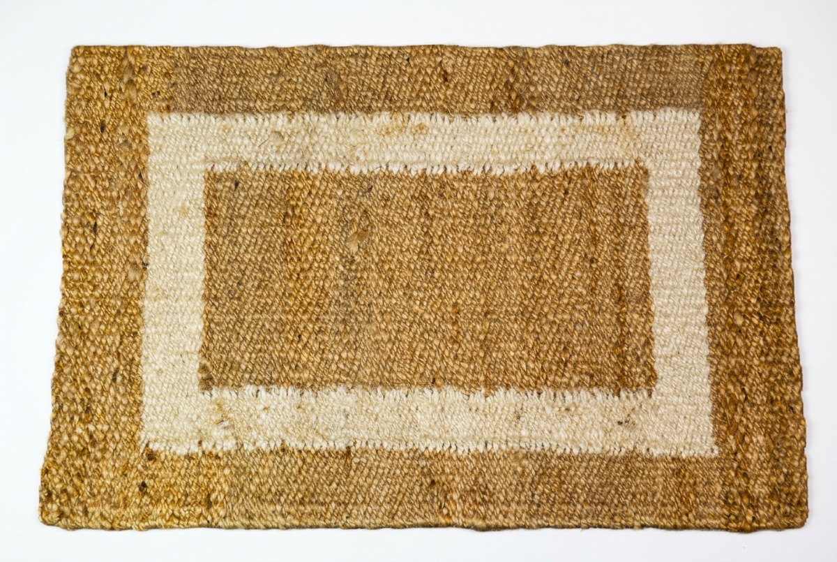 Handspun natural jute rug with white border, retouched to preserve original proportions