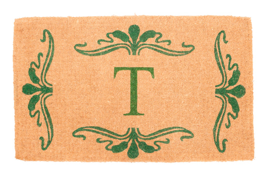 Doormat with green decorative border and letter 'T' in the center on a beige background