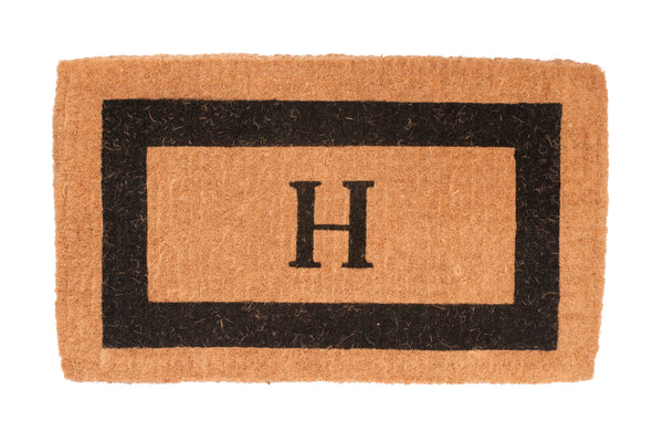 Doormat with a black border and letter 'H' on a white background