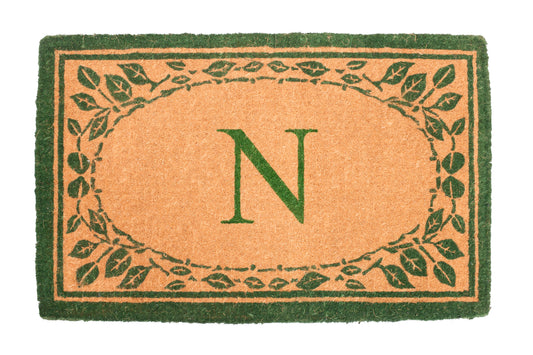 green door mat with decorative leaf pattern design