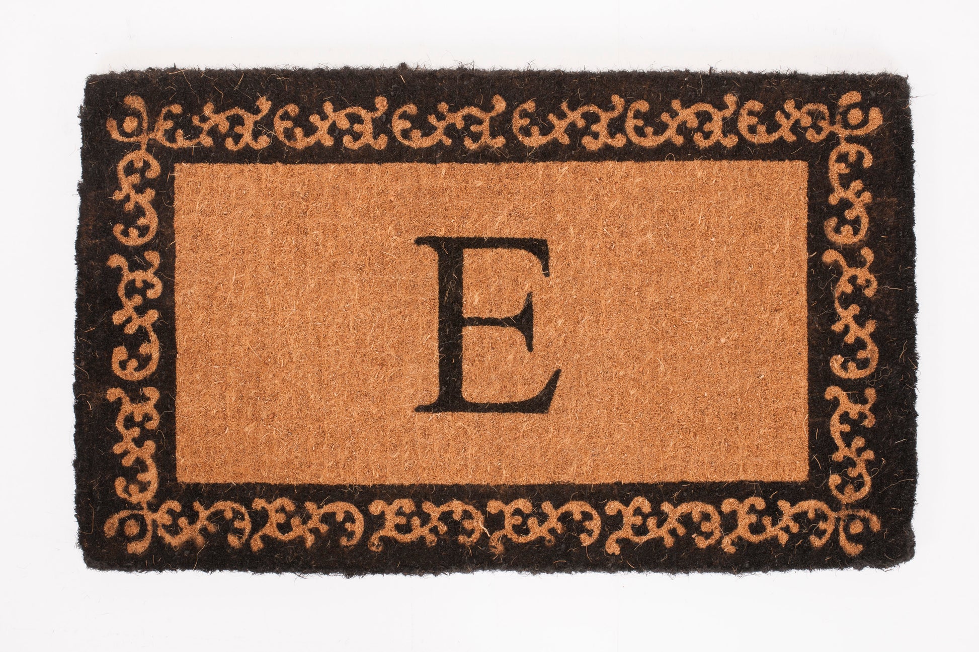 Doormat with decorative border and letter 'E' on a white background