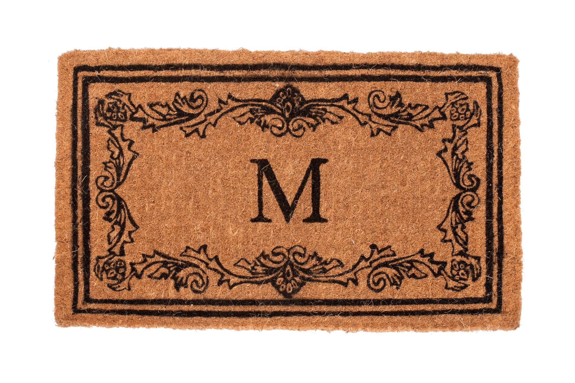 Light brown doormat with decorative border and letter 'M' on a white background