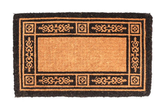 Decorative doormat with intricate border design on a white background