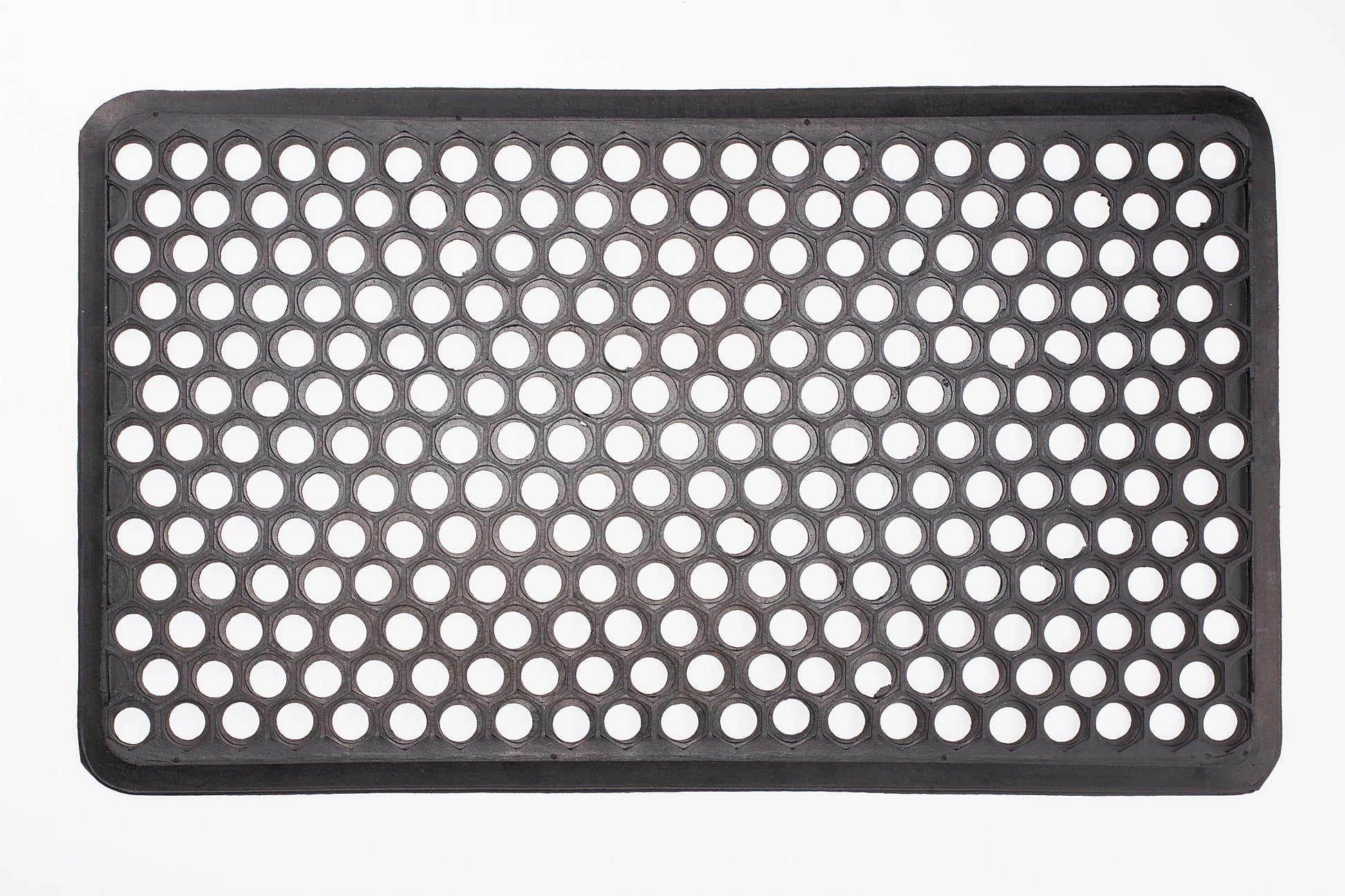 Black perforated mat on a white background