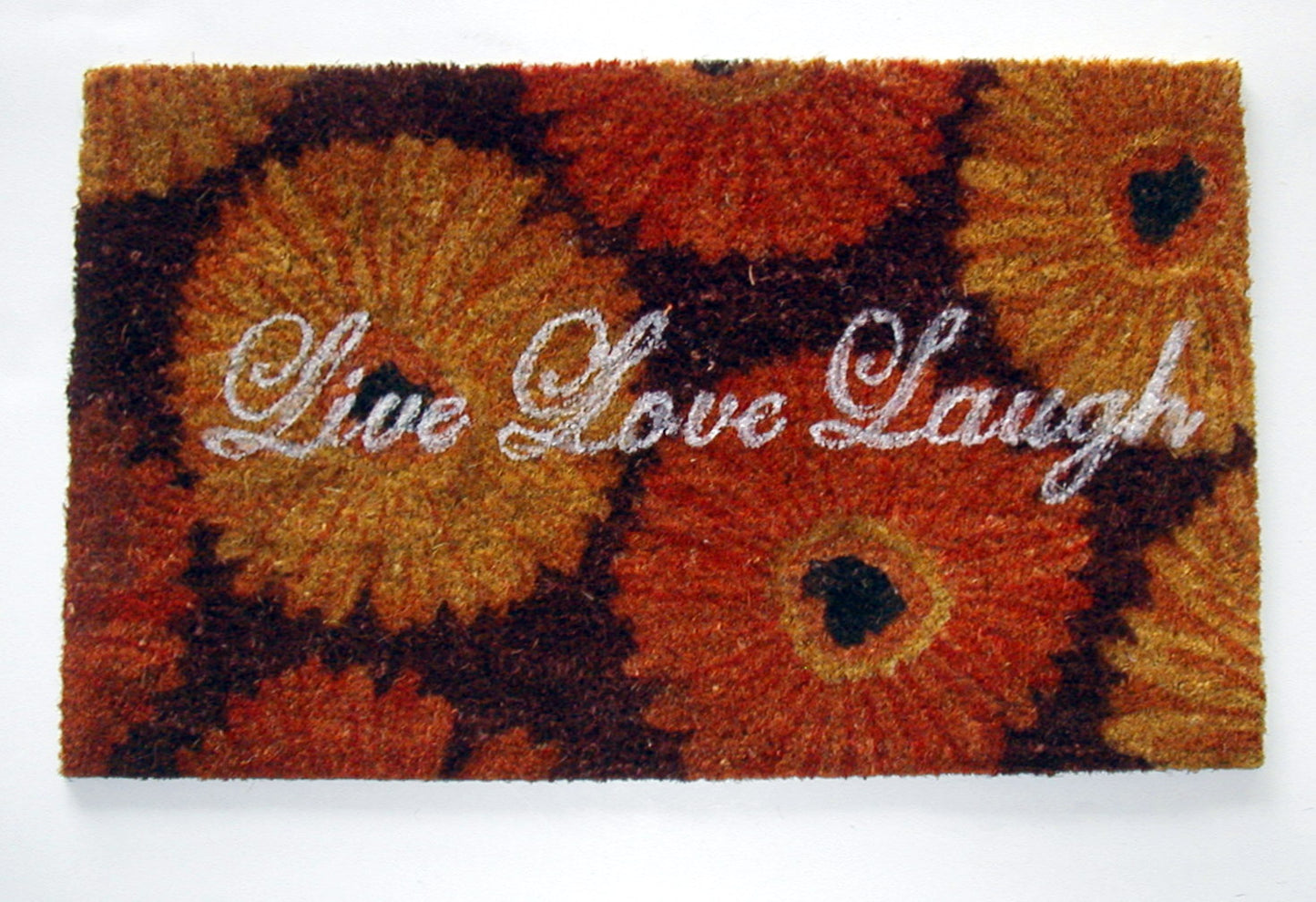 Decorative doormat with floral pattern and 'Live Love Laugh' text on a white background