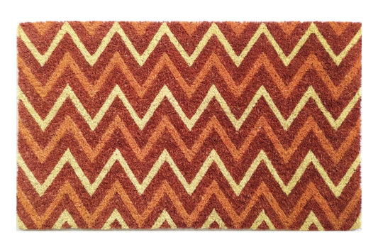 Doormat with zigzag pattern in red, orange, and beige on a white background