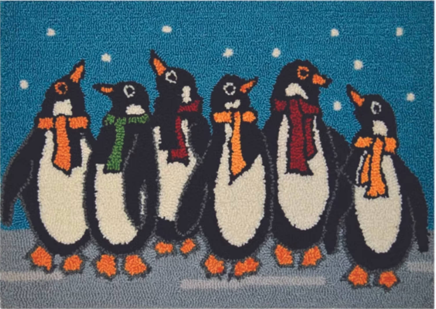 Decorative rug with penguins wearing scarves on a blue background