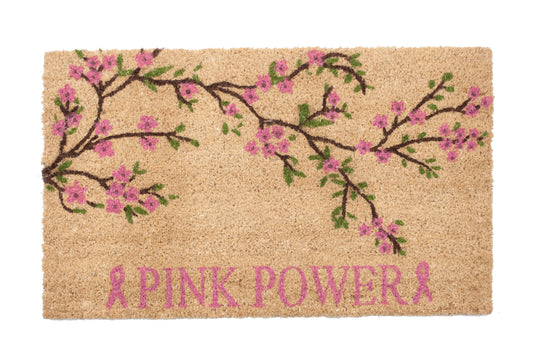 Doormat with cherry blossom design and 'Pink Power' text on a white background